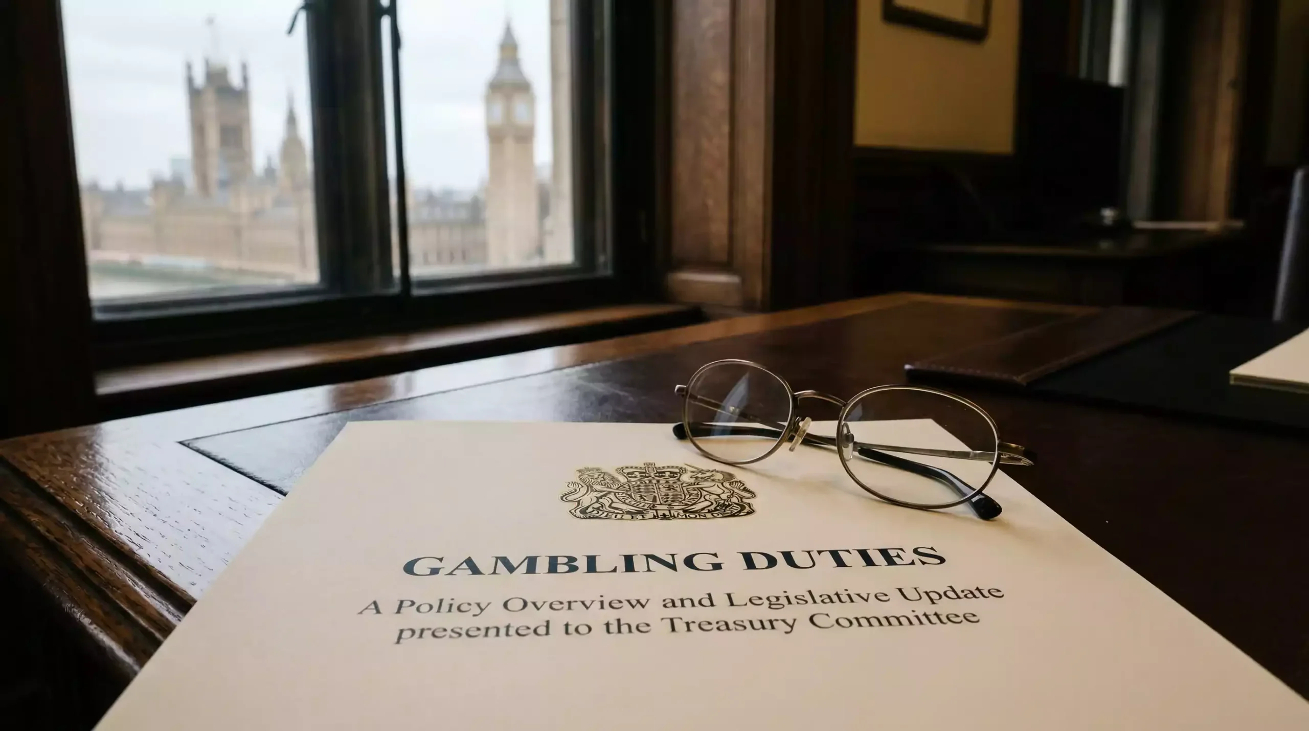 Official government document with tax policy text on a Westminster desk